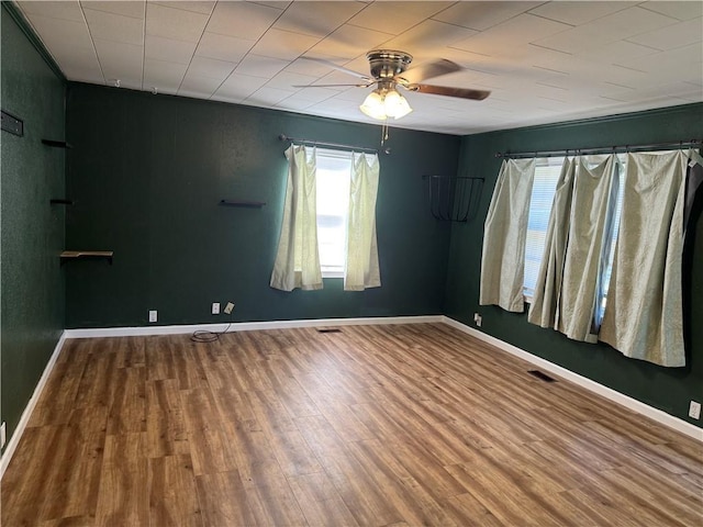 612 W Walnut St, Independence, KS 67301 - empty room with a ceiling fan, wood finished floors, and baseboards