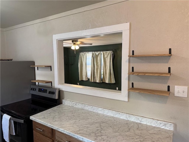 612 W Walnut St, Independence, KS 67301 - kitchen with stainless steel range with electric cooktop, a ceiling fan, and open shelves