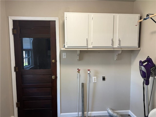 612 W Walnut St, Independence, KS 67301 - washroom with cabinet space, hookup for an electric dryer, and baseboards