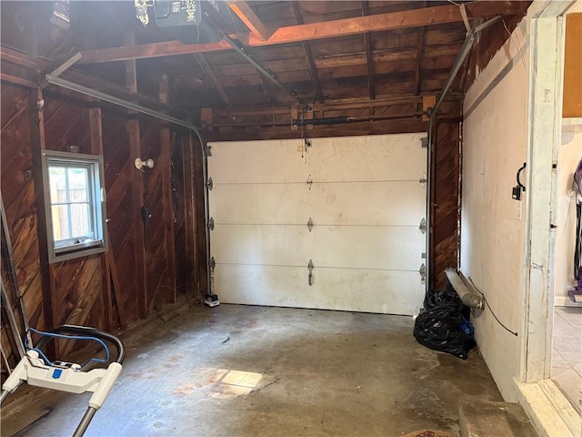 612 W Walnut St, Independence, KS 67301 - garage featuring a garage door opener