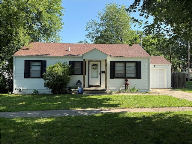 612 W Walnut St, Independence, KS 67301 - ranch-style house with concrete driveway and a shingled roof