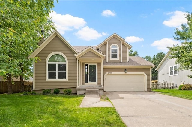 2133 S Stagecoach Dr, Olathe, KS 66062 - view of front of property featuring concrete driveway, roof with shingles, and an attached garage
