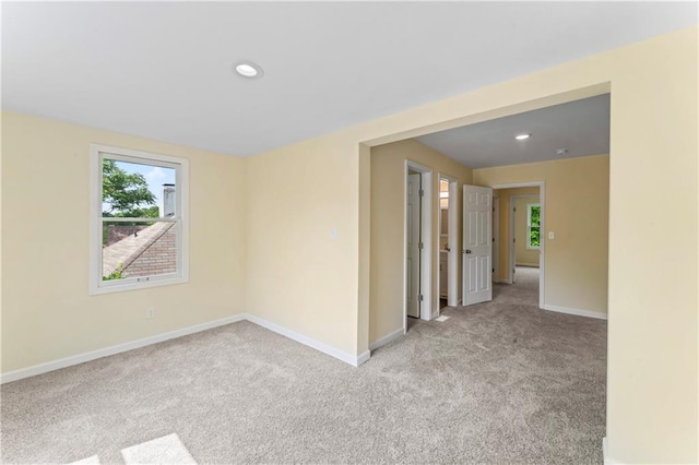 2717 Bales Ave, Kansas City, MO 64128 - spare room featuring light carpet and recessed lighting