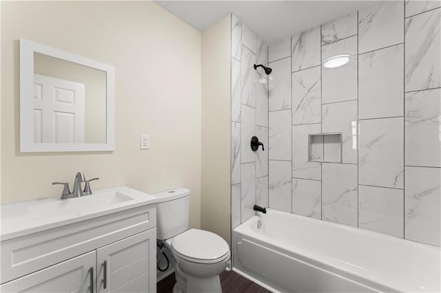 2717 Bales Ave, Kansas City, MO 64128 - bathroom with vanity, tub / shower combination, and wood finished floors