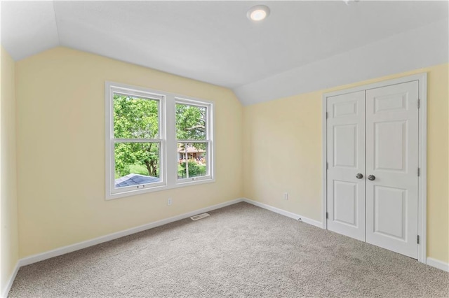 2717 Bales Ave, Kansas City, MO 64128 - bonus room featuring vaulted ceiling and carpet flooring