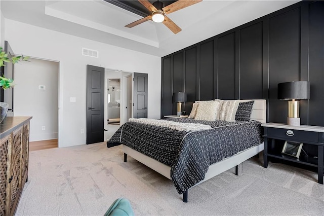 15285 W 162nd St, Olathe, KS 66062 - bedroom featuring a tray ceiling, light colored carpet, and a ceiling fan
