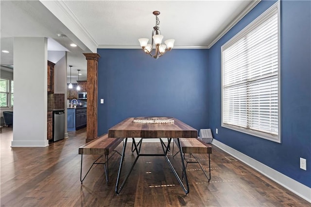4529 Lakecrest Dr, Shawnee, KS 66218 - dining area featuring a chandelier, crown molding, and dark wood-type flooring