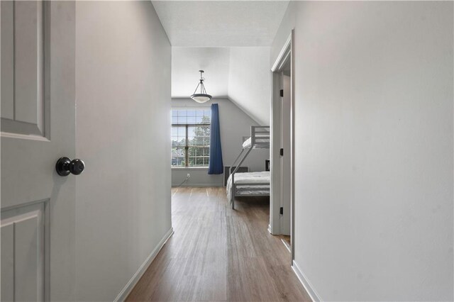 4529 Lakecrest Dr, Shawnee, KS 66218 - hallway with wood finished floors and vaulted ceiling