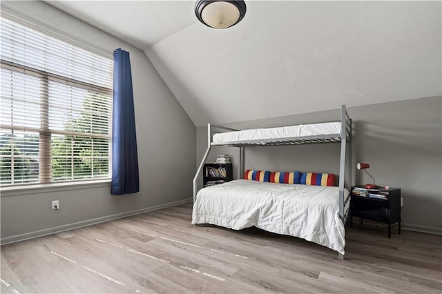 4529 Lakecrest Dr, Shawnee, KS 66218 - bedroom featuring lofted ceiling and wood finished floors