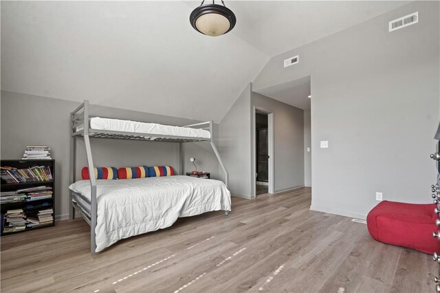 4529 Lakecrest Dr, Shawnee, KS 66218 - bedroom featuring wood finished floors and lofted ceiling