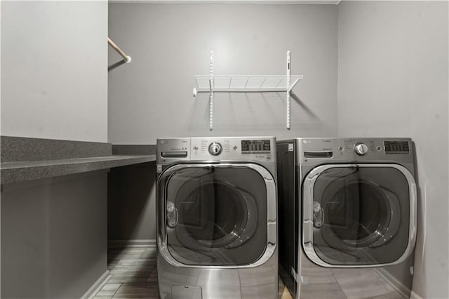 4529 Lakecrest Dr, Shawnee, KS 66218 - washroom with washing machine and clothes dryer and baseboards