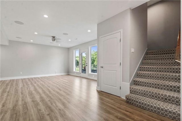 4529 Lakecrest Dr, Shawnee, KS 66218 - spare room featuring wood finished floors, a ceiling fan, stairs, and recessed lighting