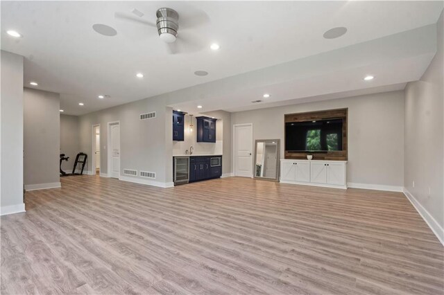 4529 Lakecrest Dr, Shawnee, KS 66218 - unfurnished living room with light wood-style floors, wet bar, beverage cooler, recessed lighting, and a ceiling fan