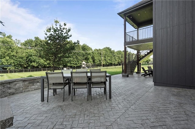 4529 Lakecrest Dr, Shawnee, KS 66218 - fenced backyard featuring a patio area, stairway, and outdoor dining space