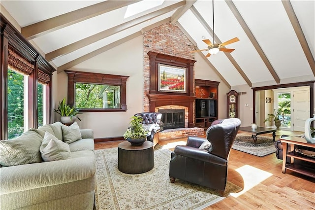 12032 Ballentine St, Overland Park, KS 66213 - living area with beamed ceiling, light wood-style flooring, a fireplace, high vaulted ceiling, and ceiling fan