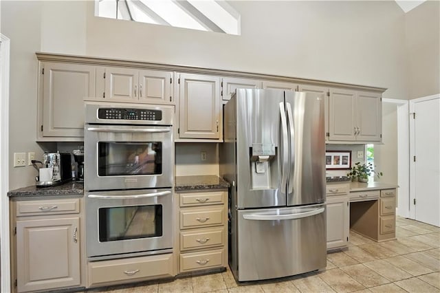 12032 Ballentine St, Overland Park, KS 66213 - kitchen with appliances with stainless steel finishes and light tile patterned floors