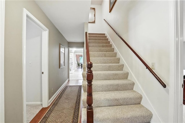 12032 Ballentine St, Overland Park, KS 66213 - stairs featuring wood finished floors and baseboards