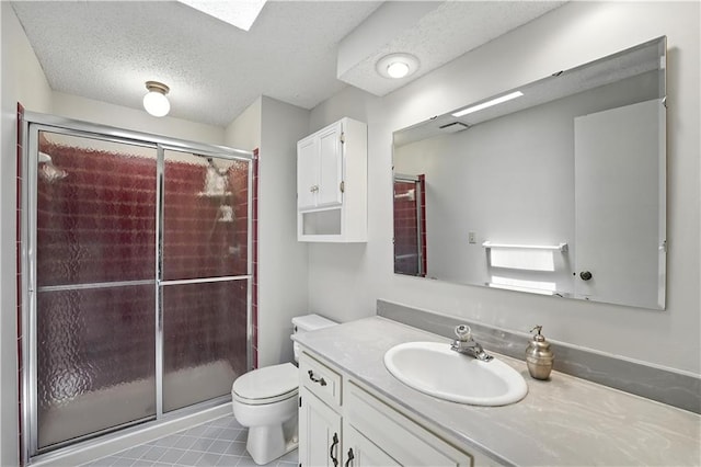 12032 Ballentine St, Overland Park, KS 66213 - bathroom featuring vanity, a shower stall, and a textured ceiling