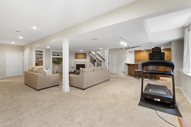 6205 W 149th St, Overland Park, KS 66223 - living area with light colored carpet, recessed lighting, stairway, and a fireplace