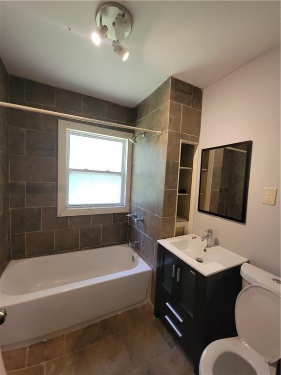 5000 Agnes Ave, Kansas City, MO 64130 - full bath with shower combination, vanity, and tile patterned floors