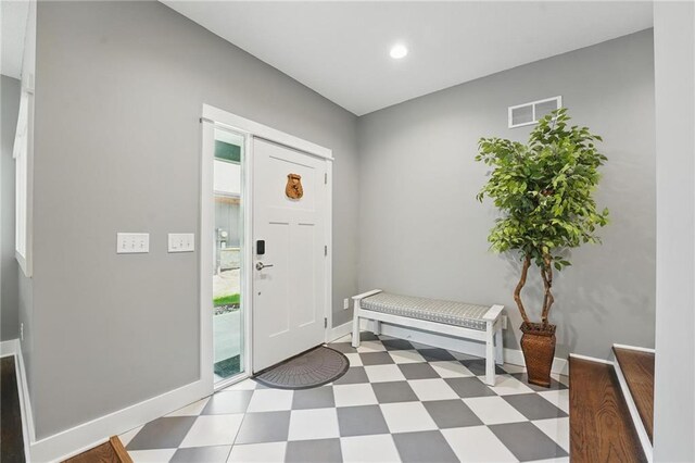 9 P St, Lees Summit, MO 64086 - entrance foyer with tile patterned floors, plenty of natural light, and recessed lighting