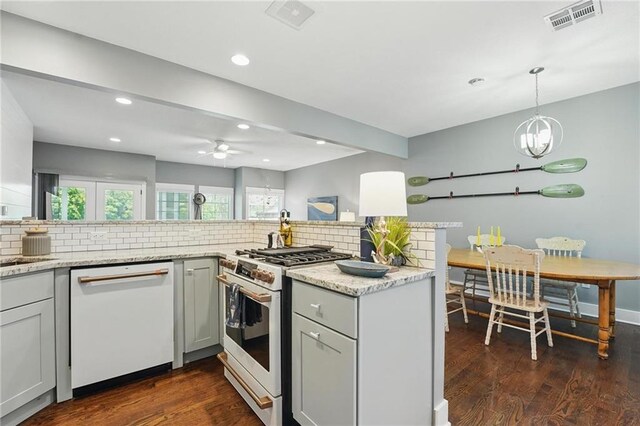 9 P St, Lees Summit, MO 64086 - kitchen featuring white appliances, decorative backsplash, a ceiling fan, dark wood-style floors, and recessed lighting