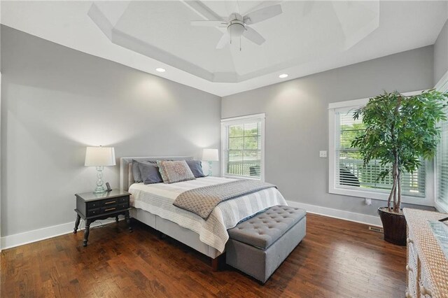9 P St, Lees Summit, MO 64086 - bedroom featuring a tray ceiling, dark wood-style floors, recessed lighting, and ceiling fan