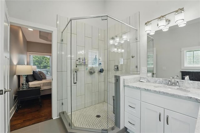 9 P St, Lees Summit, MO 64086 - bathroom with vanity, a shower stall, ensuite bath, and tile patterned flooring