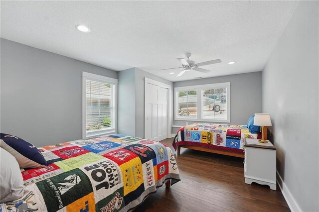 9 P St, Lees Summit, MO 64086 - bedroom featuring multiple windows, wood finished floors, a closet, a ceiling fan, and recessed lighting
