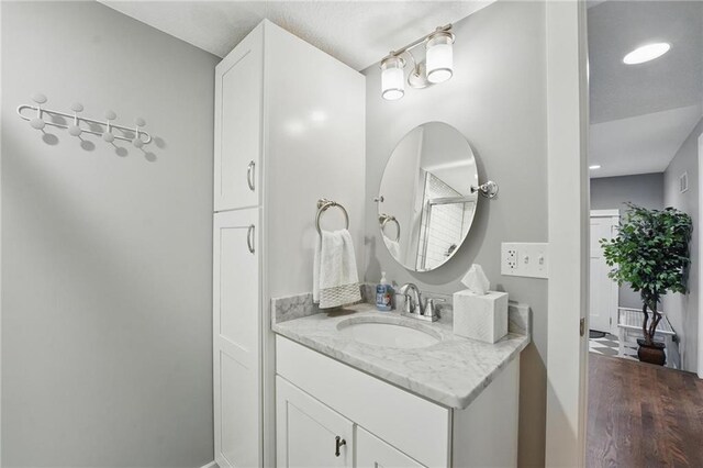 9 P St, Lees Summit, MO 64086 - bathroom featuring vanity and wood finished floors