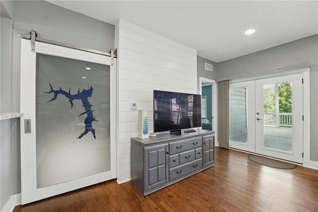 9 P St, Lees Summit, MO 64086 - living area with dark wood-style flooring, french doors, recessed lighting, and a barn door
