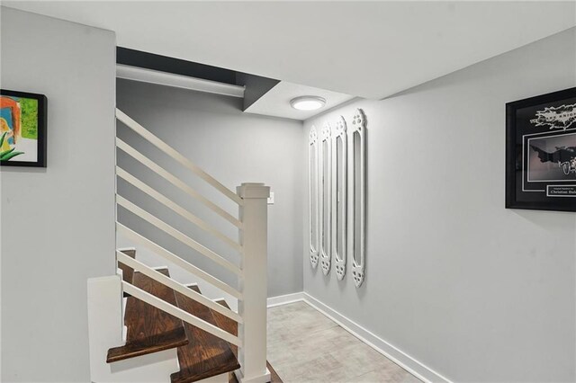 9 P St, Lees Summit, MO 64086 - staircase featuring baseboards and wood finished floors