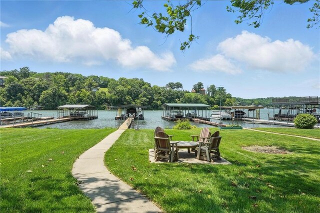 9 P St, Lees Summit, MO 64086 - view of community featuring a dock, a water view, and a lawn