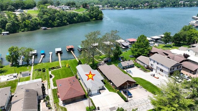 9 P St, Lees Summit, MO 64086 - aerial view of property and surrounding area with a large body of water and nearby suburban area