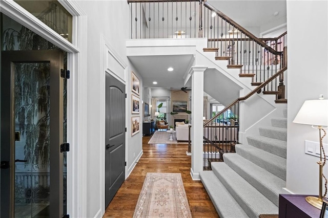 16600 Eby St, Overland Park, KS 66085 - foyer entrance with a high ceiling, wood finished floors, stairway, and ceiling fan