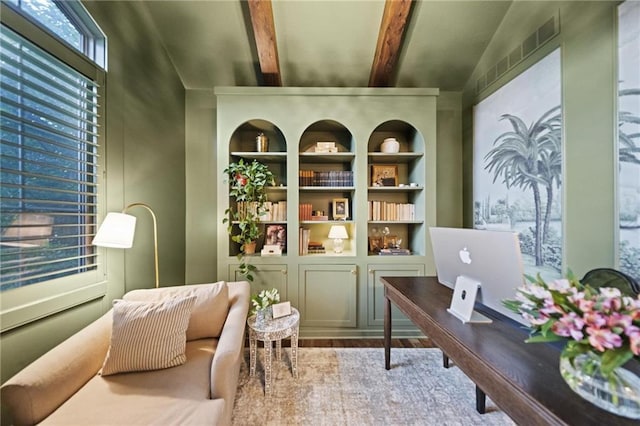 16600 Eby St, Overland Park, KS 66085 - living area featuring built in features, beam ceiling, and wood finished floors