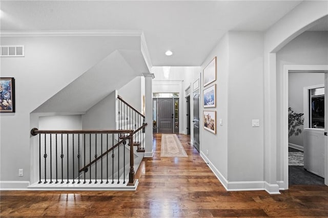 16600 Eby St, Overland Park, KS 66085 - hall featuring wood finished floors, arched walkways, recessed lighting, stairway, and ornamental molding