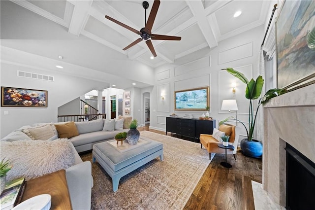 16600 Eby St, Overland Park, KS 66085 - living room featuring wood finished floors, a ceiling fan, a decorative wall, beam ceiling, and recessed lighting