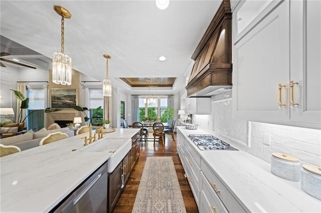 16600 Eby St, Overland Park, KS 66085 - kitchen featuring stainless steel appliances, open floor plan, dark wood-style floors, light stone counters, and recessed lighting