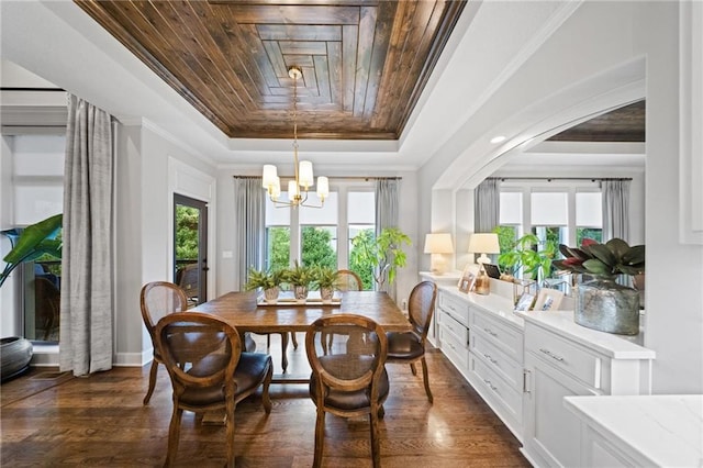 16600 Eby St, Overland Park, KS 66085 - dining space with a raised ceiling, healthy amount of natural light, a chandelier, dark wood-style floors, and crown molding