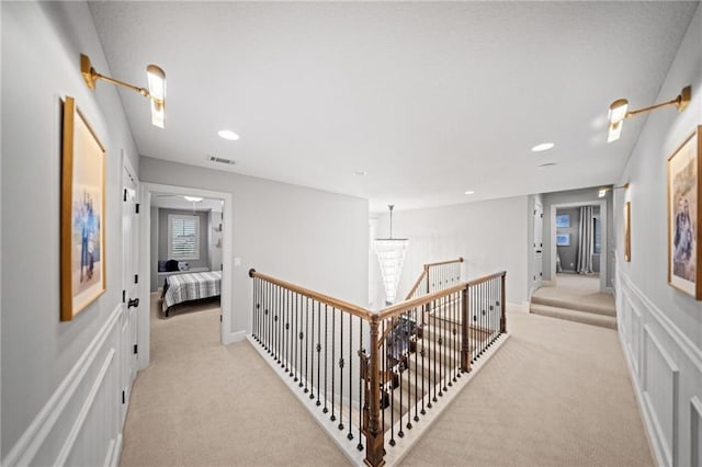 16600 Eby St, Overland Park, KS 66085 - hall with light carpet, an upstairs landing, and recessed lighting