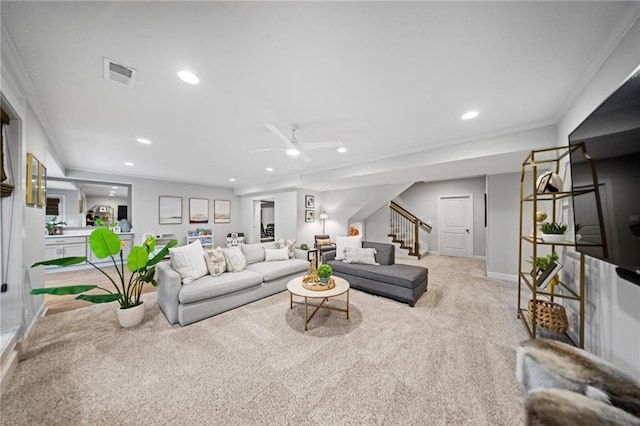 16600 Eby St, Overland Park, KS 66085 - living area featuring stairs, recessed lighting, ceiling fan, carpet flooring, and crown molding