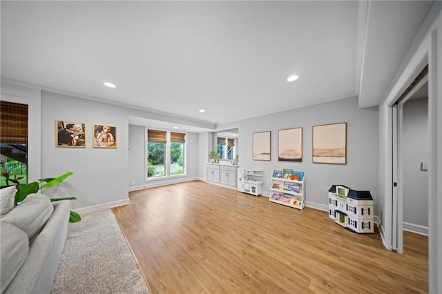 16600 Eby St, Overland Park, KS 66085 - living room with ornamental molding, recessed lighting, and wood finished floors