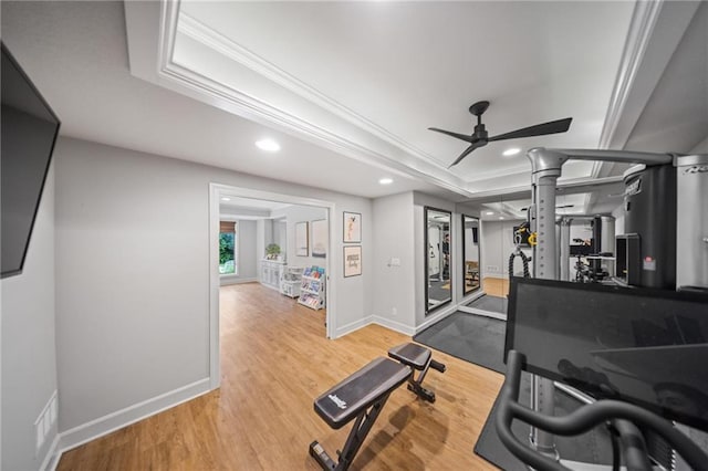 16600 Eby St, Overland Park, KS 66085 - exercise room featuring crown molding, a ceiling fan, a tray ceiling, wood finished floors, and recessed lighting