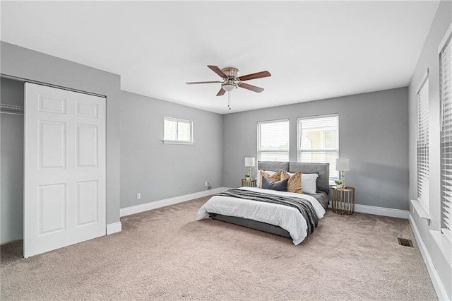 5016 Lydia Ave, Kansas City, MO 64110 - carpeted bedroom with baseboards and ceiling fan