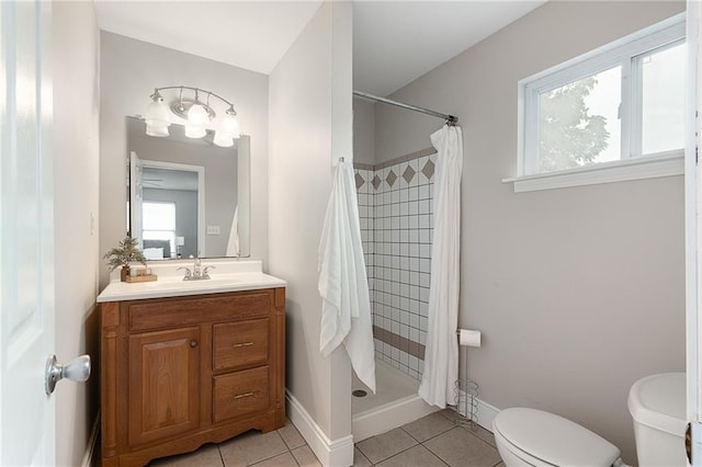 5016 Lydia Ave, Kansas City, MO 64110 - bathroom featuring vanity, tile patterned floors, and a stall shower