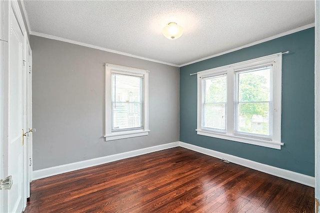 5016 Lydia Ave, Kansas City, MO 64110 - unfurnished room with dark wood-style flooring, a textured ceiling, and ornamental molding