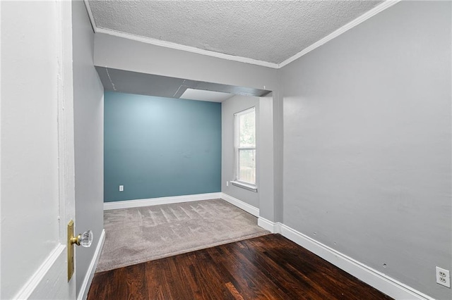 5016 Lydia Ave, Kansas City, MO 64110 - unfurnished room with wood finished floors, a textured ceiling, and crown molding