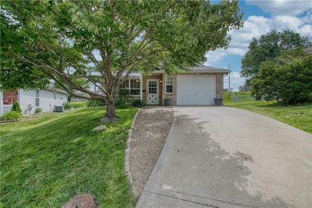 1913 S Viking Ct, Independence, MO 64057 - obstructed view of property featuring a garage, a front lawn, concrete driveway, and brick siding