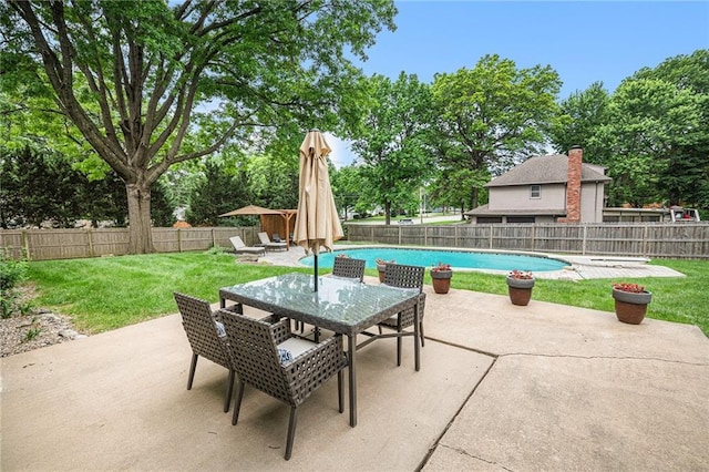 9412 Delmar St, Prairie Village, KS 66207 - fenced backyard featuring a patio area, outdoor dining space, and view of scattered trees